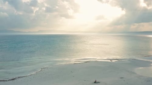 Gorgeous Aerial Tropical White Beach and Vast Pacific Ocean on Cloudy Sunset 4K