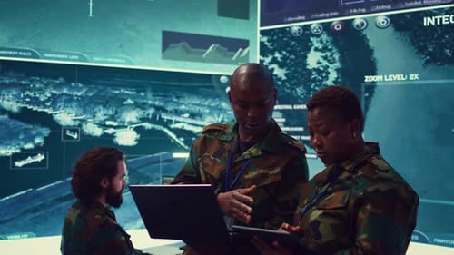 Military Team Collaborating in a Modern Office