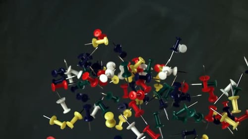 Multicolored Paper Clips Fly Up and Fall Down Filmed on a Highspeed Camera at 1000 Fps