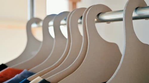 Interior of an eco-friendly shop with clothes hang on brown paper hangers