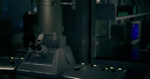 Cutting Edge Machinery in a Dimly Lit Laboratory During Evening Hours
