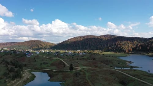 river and buildings on plateau