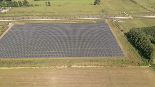 Dolly, Aerial shot. Flying over a field with solar panels