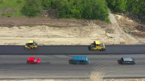 Aerial Shot of Rollers Laying New Asphalt Layer Top View to Special Machinery Making Road in