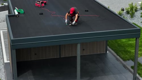 Roofing EPDM Installation in Progress on Modern Building in Bright Daylight