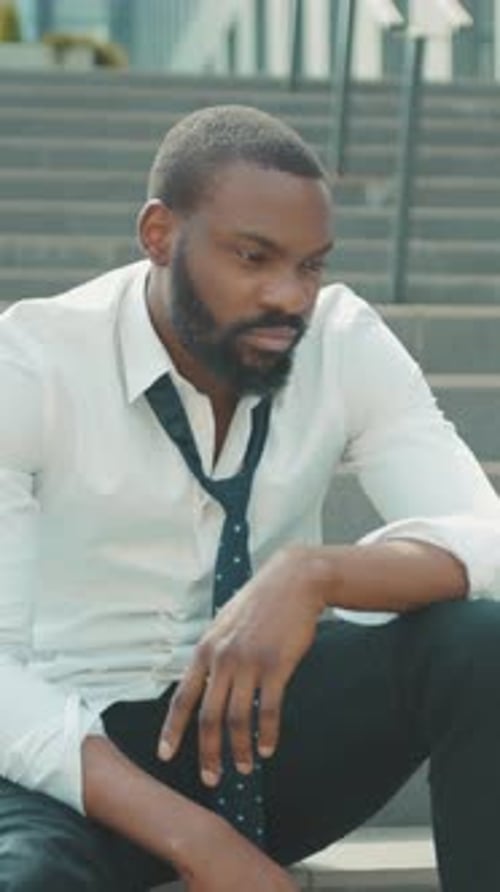 A Thoughtful and Pensive Man Dressed in Casual Yet Stylish Attire Reflecting on Lifes Journey