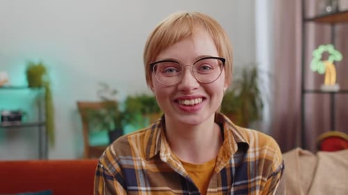 Smiling Woman Wearing Glasses Indoors