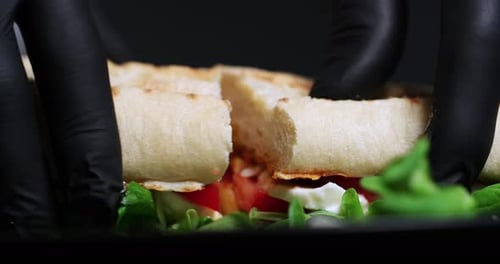 Close-up of a Tasty Sandwich Halved on Plate