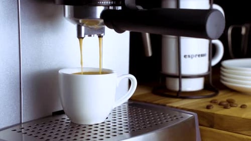 Espresso Machine Dispensing Coffee into White Mug