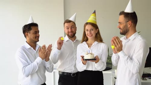 Business Team Celebrating a Birthday of Collegue in the Modern Office