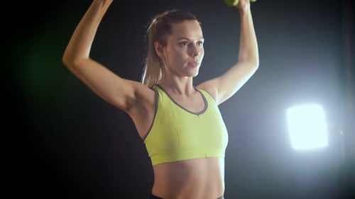 Young Blonde Woman Doing Training with Dumbbells in Hands Attractive