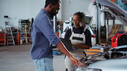 Car Technician Listens to Client Request