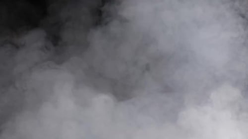 Abstract Smoke Billowing Across a Black Background