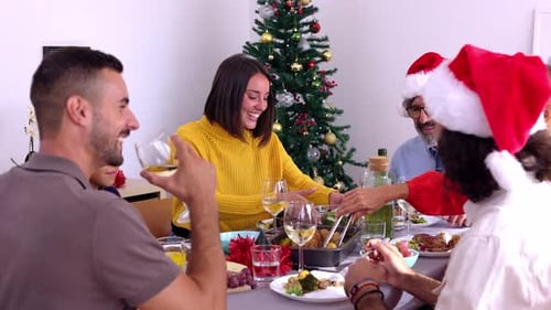 Multi Generational Group of Happy Family Having Christmas Dinner at Home