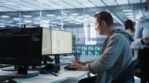 Man Working in Server Hub Capable of Processing Vast Amounts of Data