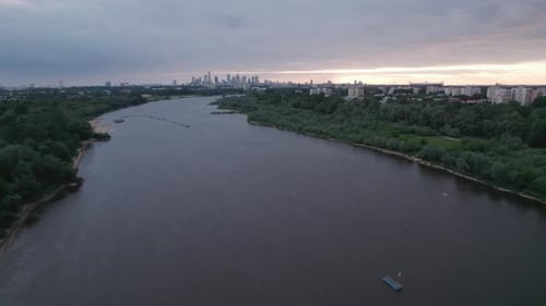 Aunset over the river. Drone aerial view of River Vistula in Warsaw 4K