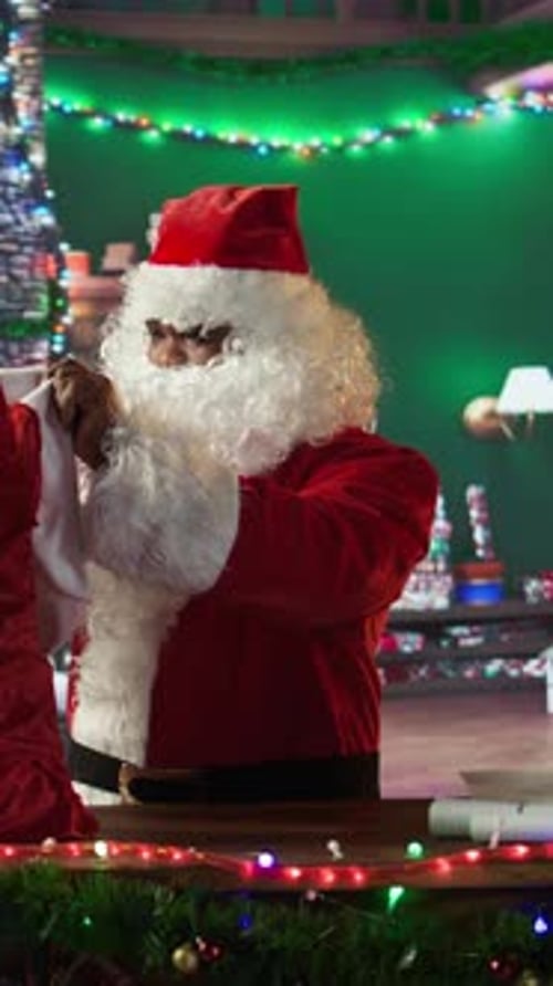 Vertical Video Amazed African American Santa Claus Opening His Bag Full of Gifts