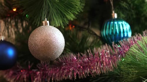 Sparkling Christmas Tree Ornaments and Purple Tinsel