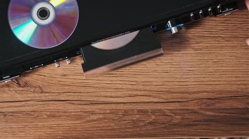 Compact Disc is Ejected From the DVD Player