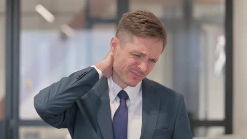 Portrait of Young Businessman with Neck Fatigue and Pain