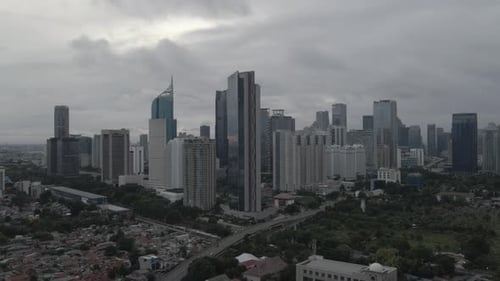 Aerial view of city buildings in Jakarta, Indonesia. Shoot on cloudy morning with D-Log