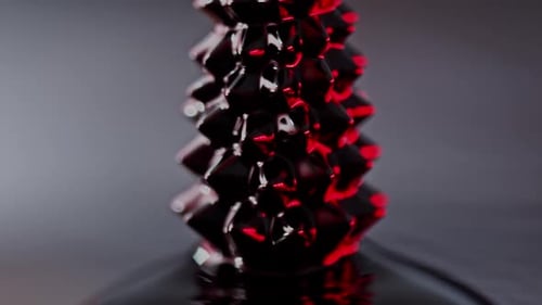 fluid forming spikes in a dark abstract atmosphere