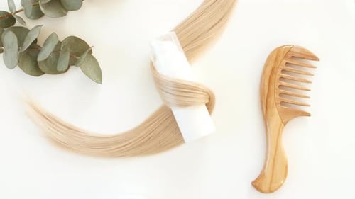 Hair Care Products with Blonde Hair and Comb