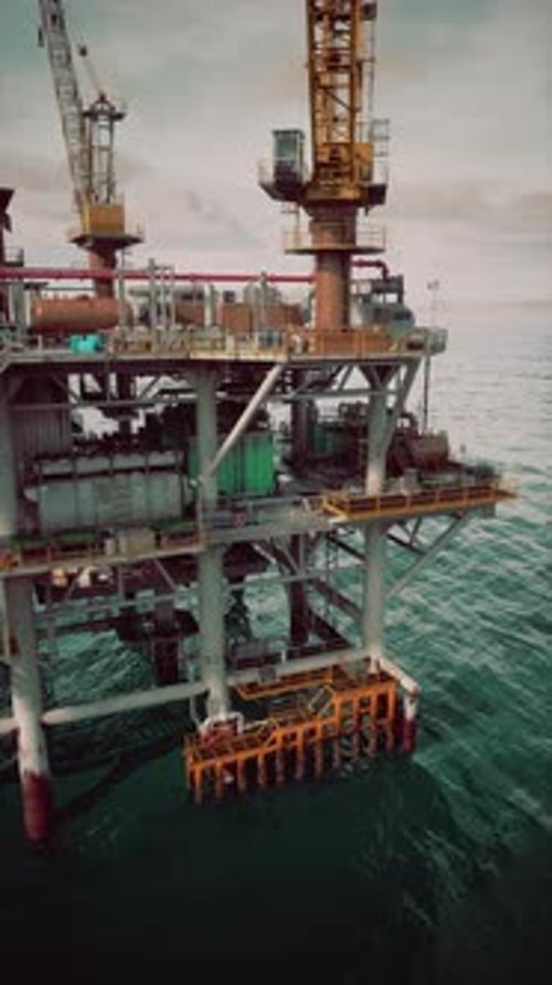 Old Oil Rig Operating in the Ocean