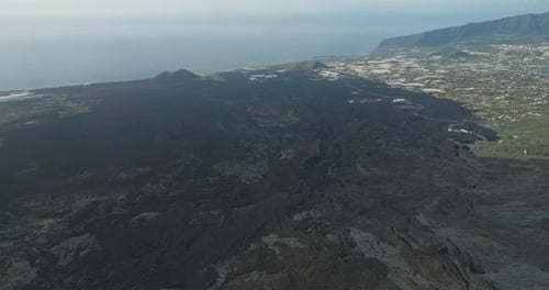 Drone view of blackened lava fields post Tajogaite eruption on La Palma