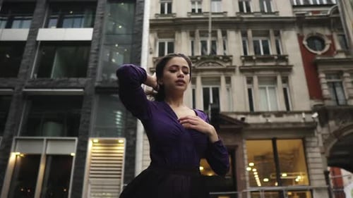 Elegant Woman Posing in Urban Environment