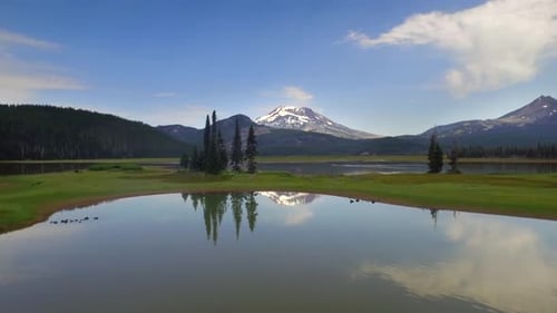 Oregon mountainside lakeside beauty reflecting under a blue sky near bend Oregon