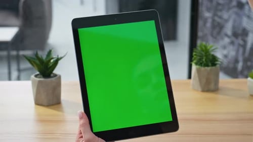 Tablet User Scrolling Chromakey Display Surfing Internet at Home Office Closeup