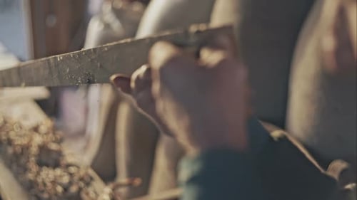 Senior Carpenter Checking Sanded Plank in His Workshop