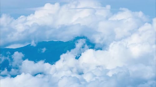 Aerial view of sea of fog on tropical mountains in the early morning.