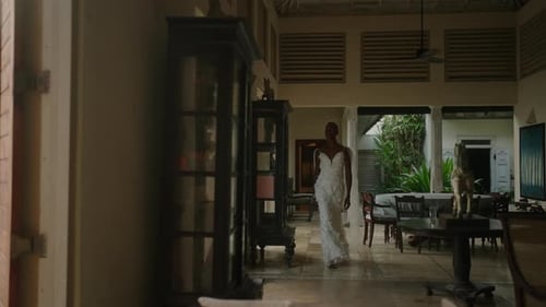 Elegant Woman in White Dress by Tropical Villa Pool