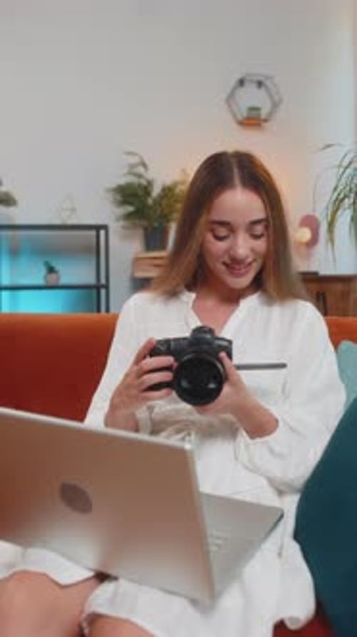 Woman Works on Camera and Laptop at Home