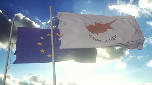 Cyprus and European Union Flags Waving Against Sunny Blue Sky