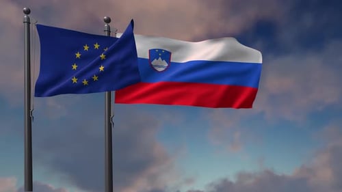 European Union and Slovenia Flags Waving on Flagpoles