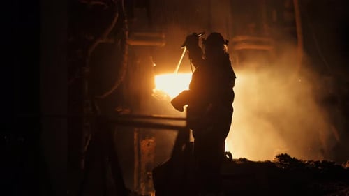 Metallurgical Plant a Worker Takes Out a Temperature Sensor From a Blast Furnace for Smelting Metal