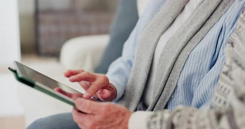 Two People Using a Tablet Indoors Together