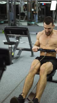 Shirtless Athlete Training Rowing Machine Exercise Intense Endurance ...