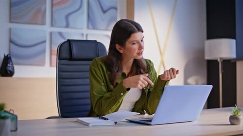 Woman Freelancer Talking Virtual Chat Looking Laptop Webcam in Office Closeup