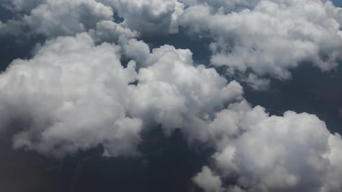 view of the white cloud airplane cabin