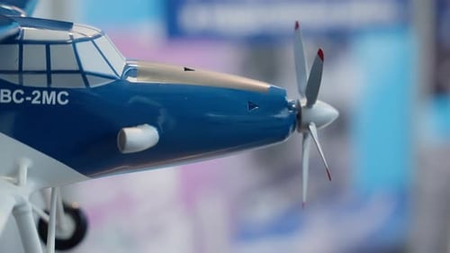 Model Airplane Close-Up of Blue and White Aircraft