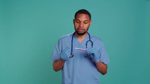 Portrait of Doctor Holding Pregnancy Test Doing Instructional Video
