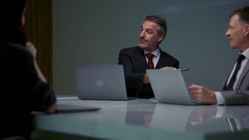 Business Team Discussing Results in Corporate Meeting