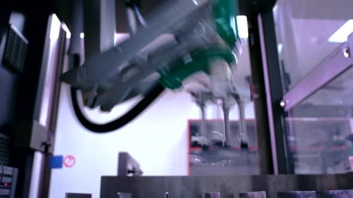 Robotic Arm Factory. Packaging Machinery. Robot Arm at Packaging Line. Close Up