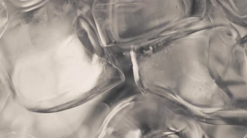 Macro footage of clear glistening ice cubes