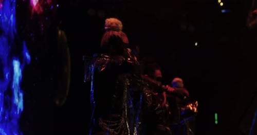 Fashionable Performer Dancing on Stage at Night