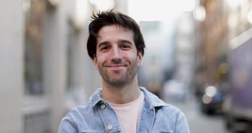 Portrait of young adult male on street